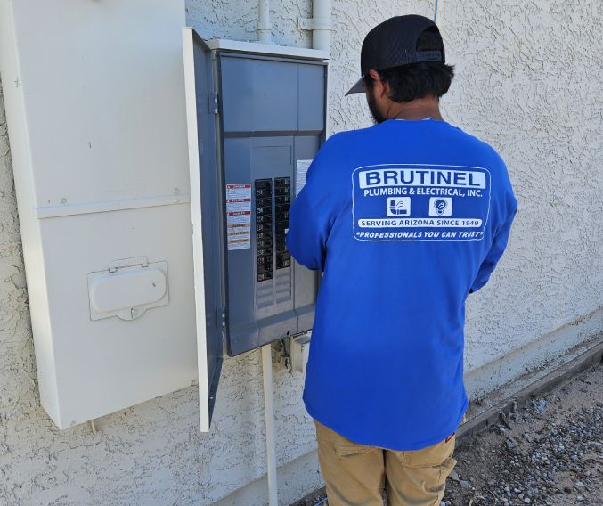 A man in blue shirt and hat looking at the meter.