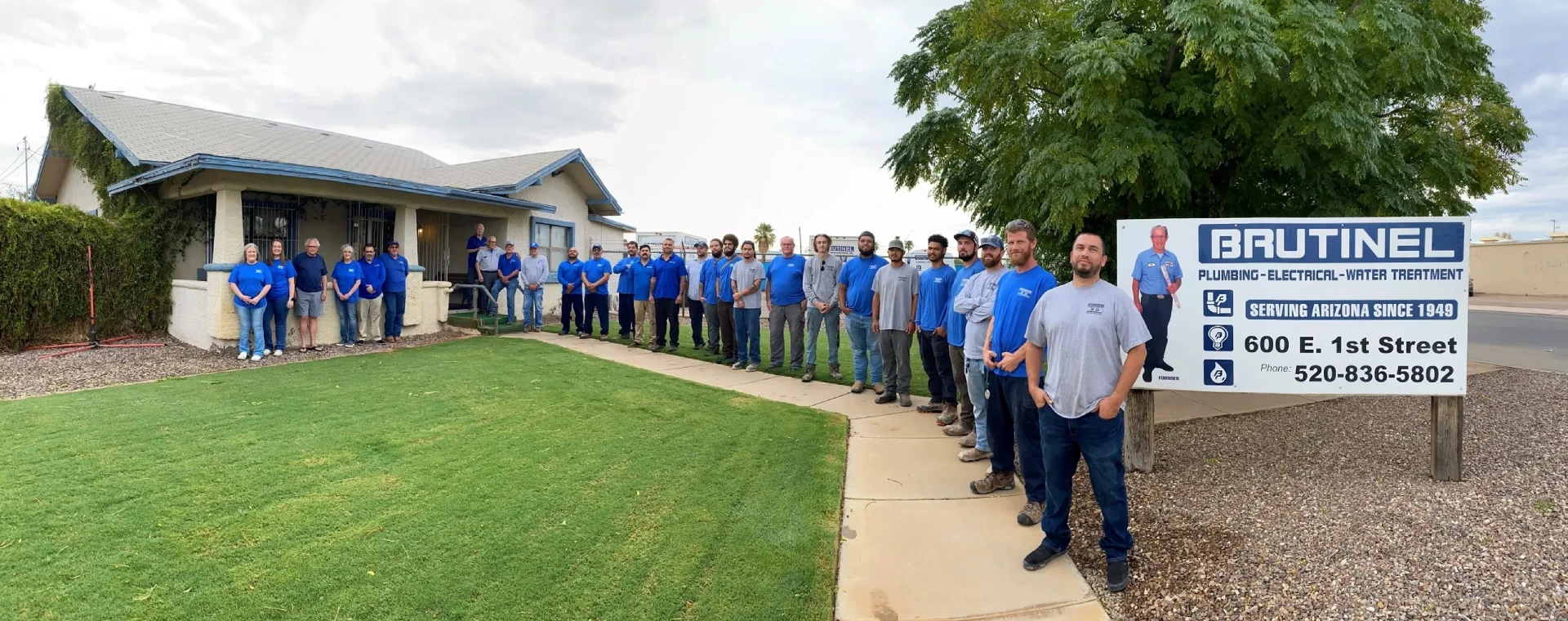 A group of men standing in front of a building.