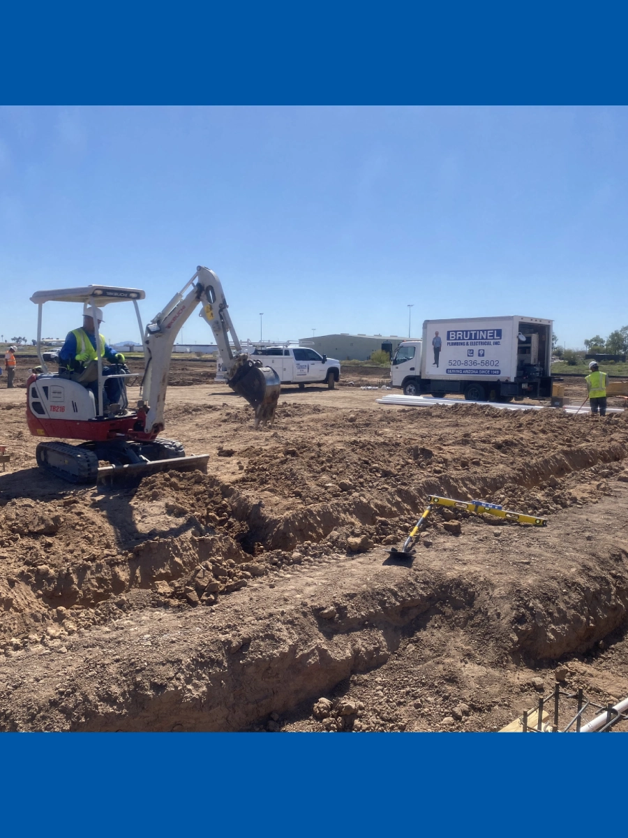 A construction site with workers and equipment.